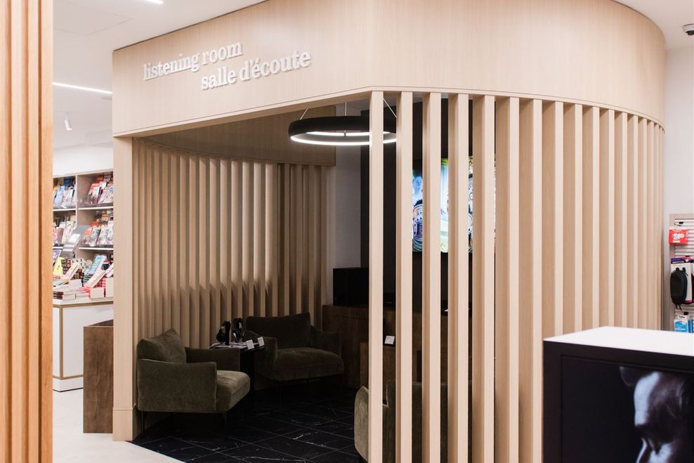 Inside the listening room at YVR’s Cascadia Collection, where travellers can test out premium headphones with vinyl or concert film audio. (Supplied)