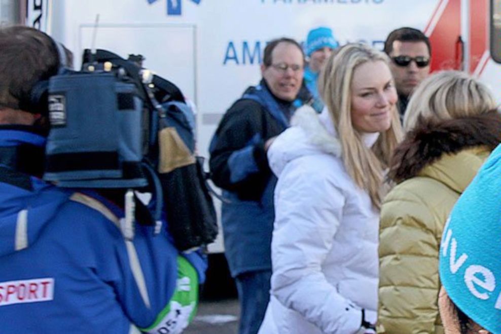 A U.S. Department of State special agent (rear right, dark glasses) keeps watch over U.S. Olympian and gold medalist Lindsey Vonn (white jacket) in Whistler during the Vancouver 2010 Winter Olympics. (U.S. Department of State)