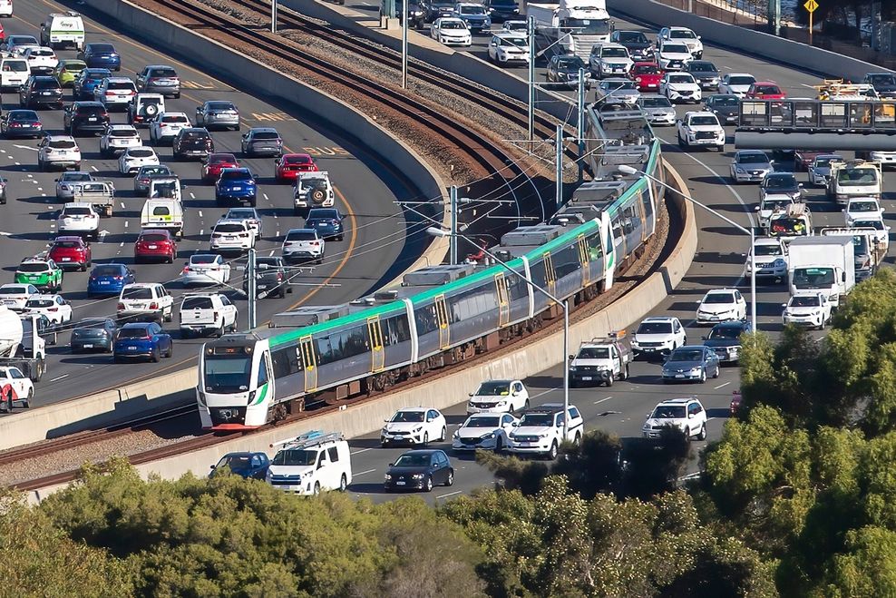 Regional rail train running along the median of a major highway in Perth, Australia. (Karolis Kavolelis/Shutterstock)